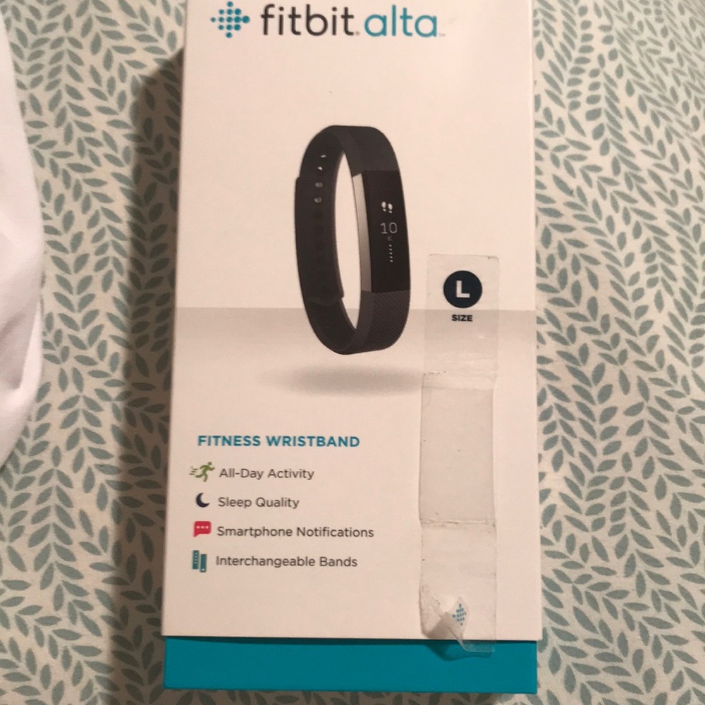 Fitbit alta with a light pink leather band